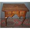 Image 1 : A WALNUT LOWBOY, EARLY 18th CENTURY, with cross and feather banded top, the central frieze drawer...