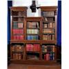 Image 1 : two INVERTED BOOKCASES, with panelled doors to the base, 205cms wide x 234cms high x 54cms deep...