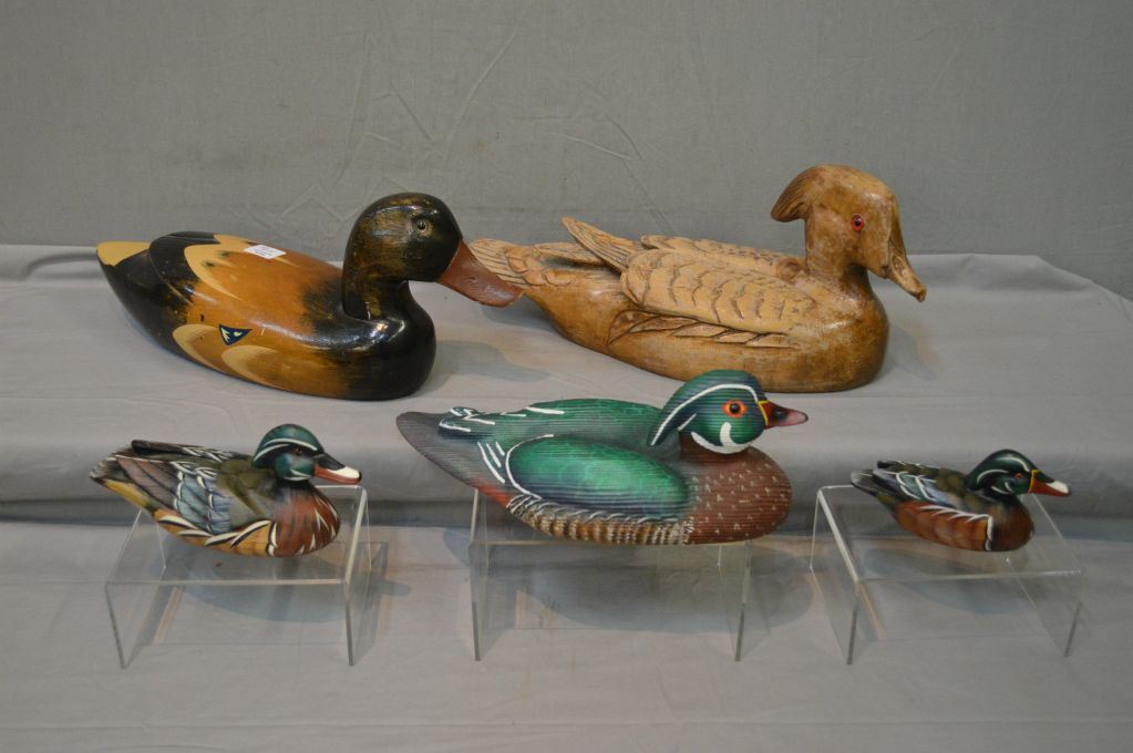 Selection of collectible carved wooden ducks including decoys and