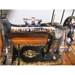 Williams Sewing Machine in a Cabinet with the Accessories in the Drawers