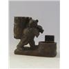 Image 1 : A TREEN SMOKERS COMPANION, carved as a bear with axe carrying a container, width 16cm  £30-50...