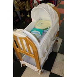 EDDIE BAUER SAND COLOURED ROCKING BASSINET