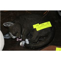 BLACK CONCRETE SLEEPING CAT