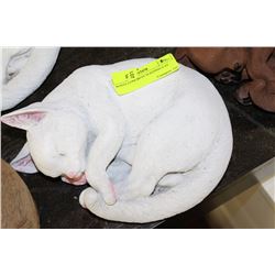 WHITE CONCRETE SLEEPING CAT