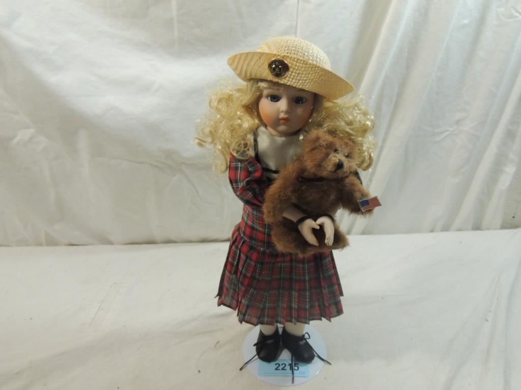 porcelain doll with teddy bear