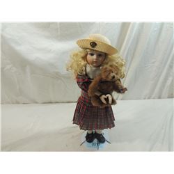 PORCELAIN DOLL WITH TEDDY BEAR