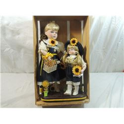 PAIR SUNFLOWER PORCELAIN DOLLS