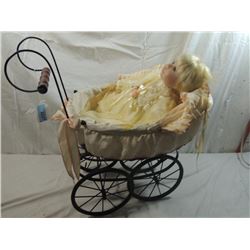 PORCELAIN DOLL IN WICKER CARRIAGE