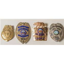 Four Law Enforcement Badges