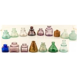 16 ink wells of all sizes, shapes, and colors