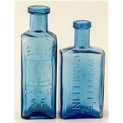 Two small cobalt blue  window bottles