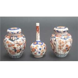 Pair of late 19th century Japanese Imari pot pourri jars, covers and inner covers, the ovoid flut...