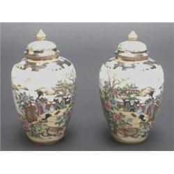 Pair of Japanese Noritake ovoid vases and covers, painted in colours with figures on a terrace an...