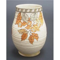 Crown Ducal vase designed by Charlotte Rhead, tube lined with autumnal flowers and leaves on a ri...