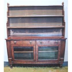 REGENCY MAHOGANY BOOKCASE, the open graduated three tier top with adjustable shelves and turned f...