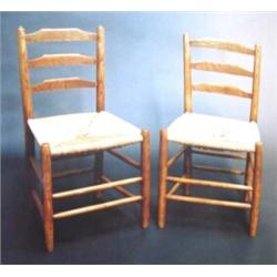 Set of four Gimson ash 'Clissett' ladder back chairs with rush seats. See illustration....