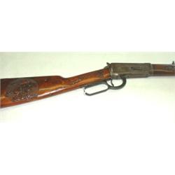 1894 Winchester 30 WCF. Ornately carved stock. Very good plus condition. $500-1100...