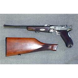 Luger carbine with detachable stock. Checkered stock. Gun jammed. We believe the problem is the m...