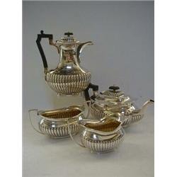 A FOUR PIECE STOP FLUTED TEA SERVICE, Sheffield 1919 and 1921, (approximate weight 50oz all in) (...