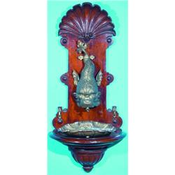 DOLPHIN LEVABO - Cast brass dolphin and shell basin on carved pine wall fixture, top is carved wi...