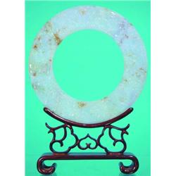 JADE PI - Carved Jade ring on wood open work stand, late 19th Century. H-9", Dia.-6 1/4", VG-EX....