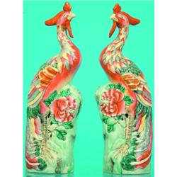 PAIR OF CHINESE PHOENIX BIRDS-Painted porcelain, late 19th Century; one comb repaired, interior s...