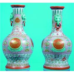 PAIR OF ORIENTAL BOTTLE VASES - Painted porcelain, elephant masks with loose rings, drilled for l...