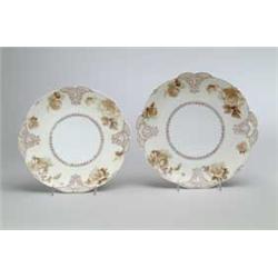 TWO HANDLED OLD IVORY CAKE PLATES.