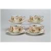 Image 1 : FOUR OLD IVORY CUPS AND SAUCERS.