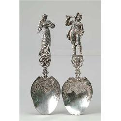 2 FIGURAL SILVER SERVING SPOONS.