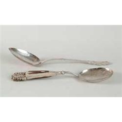 TWO LARGE SILVER SERVING SPOONS.