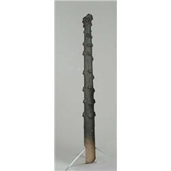 TREE TRUNK FORM HITCHING POST.