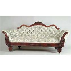 CARVED WALNUT VICTORIAN SOFA.