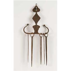 IRON SKEWER HOLDER AND FIVE SKEWERS.
