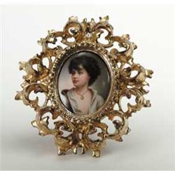 OVAL MINIATURE PAINTING ON PORCELAIN OF YOUNG GIRL.