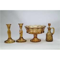 FOUR PIECES OF AMBER GLASS.