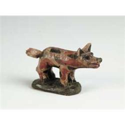 SMALL CARVED AND PAINTED DOG.