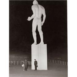 WEEGEE (ARTHUR FEELIG), (American, 1899-1968), COP GUARDING STATUE, FROM SOUVENIR HUNTERS, inscri...