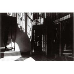 HARRY CALLAHAN, (American, 1912-1999), WOMAN IN REVOLVING DOOR, gelatin silver print, 63/16 x 95/...
