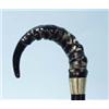Image 1 : An English ebonized wood walking stick with carved horn handle and decorative silver band. Hallma…