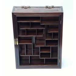 A Chinese blackwood hanging vitrine with random arrangement of pagoda form shelves. 20" high, 14 …