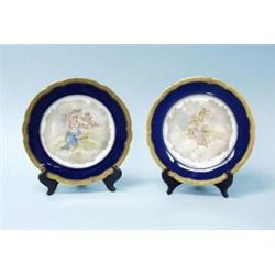 A pair of antique French Limoges porcelain wall plates, made for Mappin & Webb. Circular form, wi…