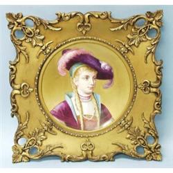 An antique English porcelain wallplate. Gilt ground handpainted with the portrait of a young lady…