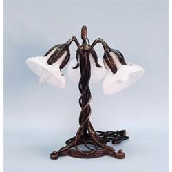 ART NOUVEAU - A fine multipatinated wrought iron table lamp with frosted art glass tulip form sha…