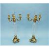 A fine pair of antique French Empire style Baccarat crystal and gilt bronze candelabra. The diamo…