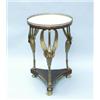 An antique French Empire style mahogany and bronze tripod table. The circular white marble top wi…