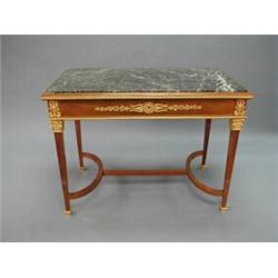 A fine antique French Louis XVI style mahogany salon table. Rectangular form, gilt bronze mounted…