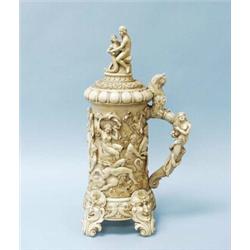 An important 18th century German carved ivory tankard. The large columnar vessel relief carved wi…