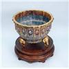 A pair of magnificent Chinese cloisonne jardinieres. Large scalloped bodies with a colourful trad…