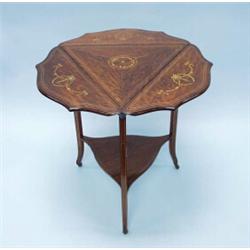 An unusual antique English satinwood inlaid envelope table. The triangular top with folding sides…